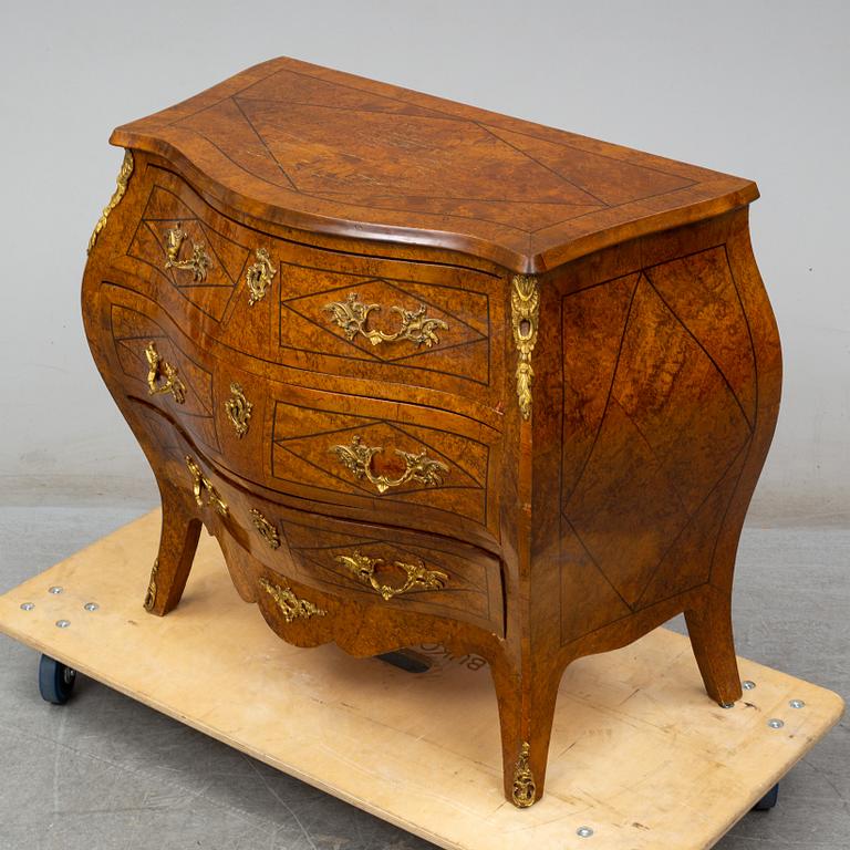 A mid 20th century rococo style chest of three drawers.