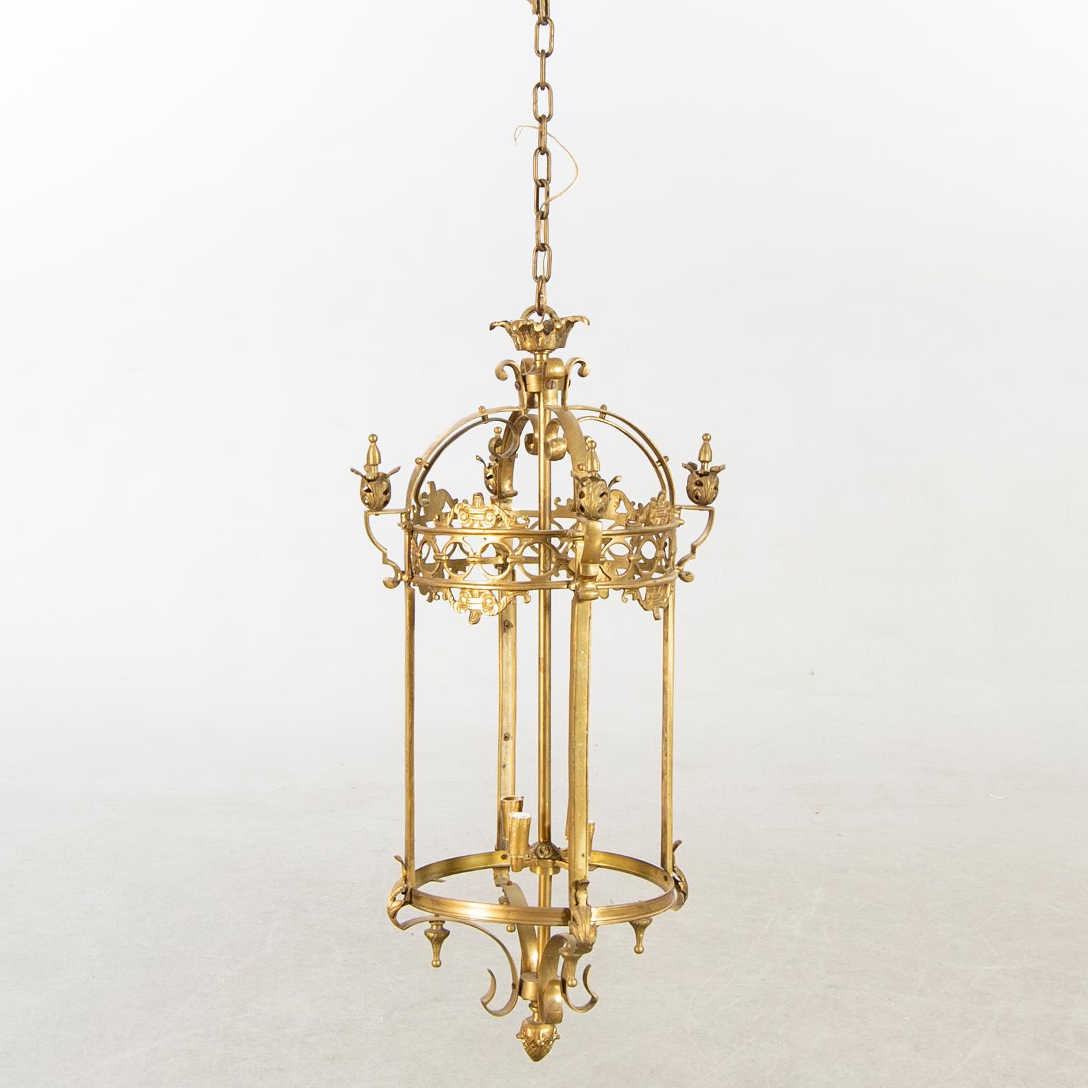 A 20th century brass ceiling lamp in Louis XV-style.