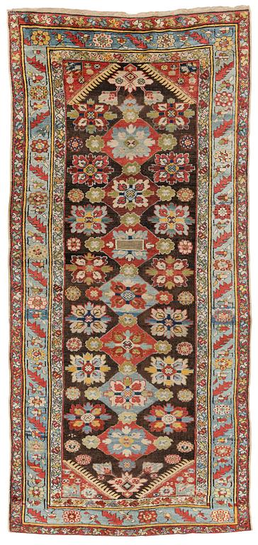 An antique Karabagh carpet,  ca 330 x 157 cm (one end with 1-3 cm flat weave).