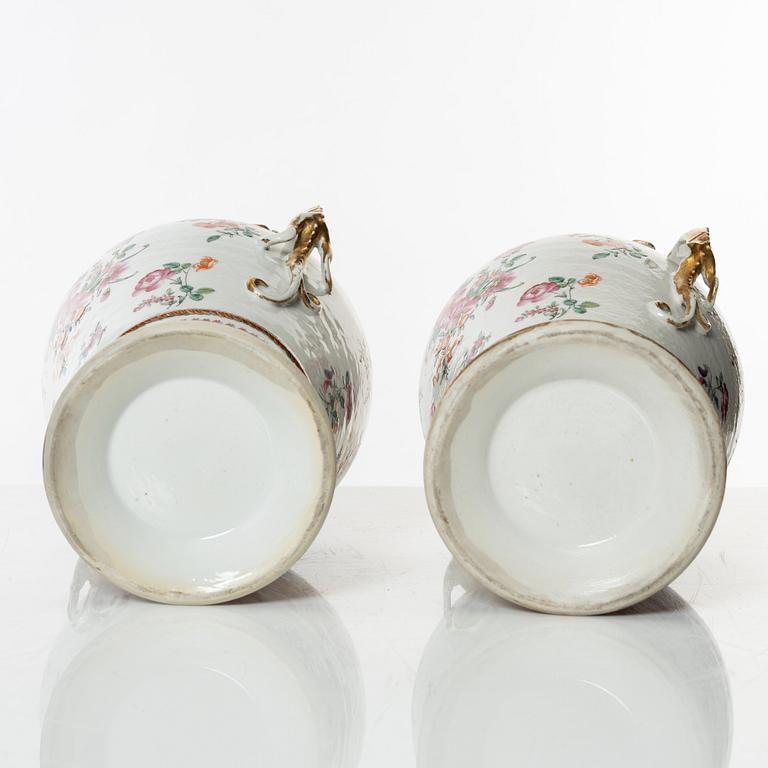 A pair of famille rose jars with gilded silver covers, Qing dynasty, Qianlong (1736-95).