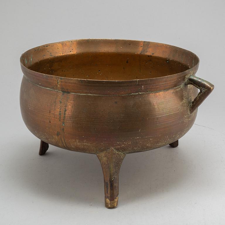 A late 18th or early 19th century bronze and iron pot.