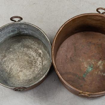 two copper pots from the 19th century.