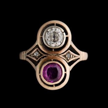 A RING, old cut diamond, facetted ruby, 14K (56) gold. Nikolai Kemper, St Petersburg 1892-1916.