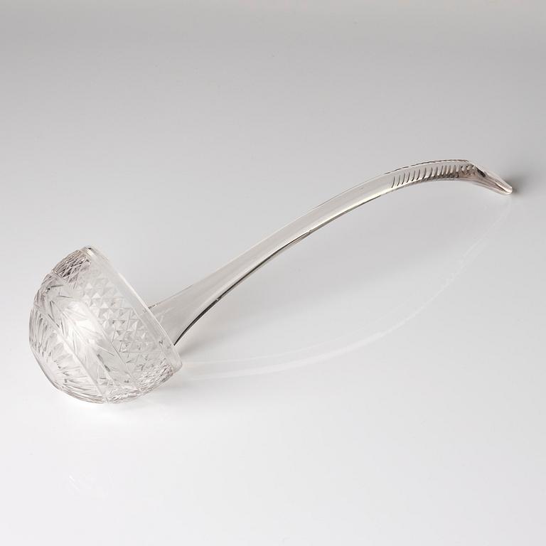 A cut glass punch bowl with cover, stand and ladle, Empire, first part of the 19th century.