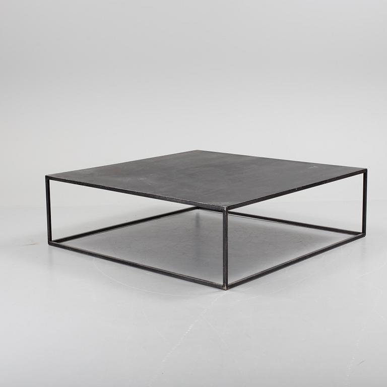 A modern square metal sofa table.