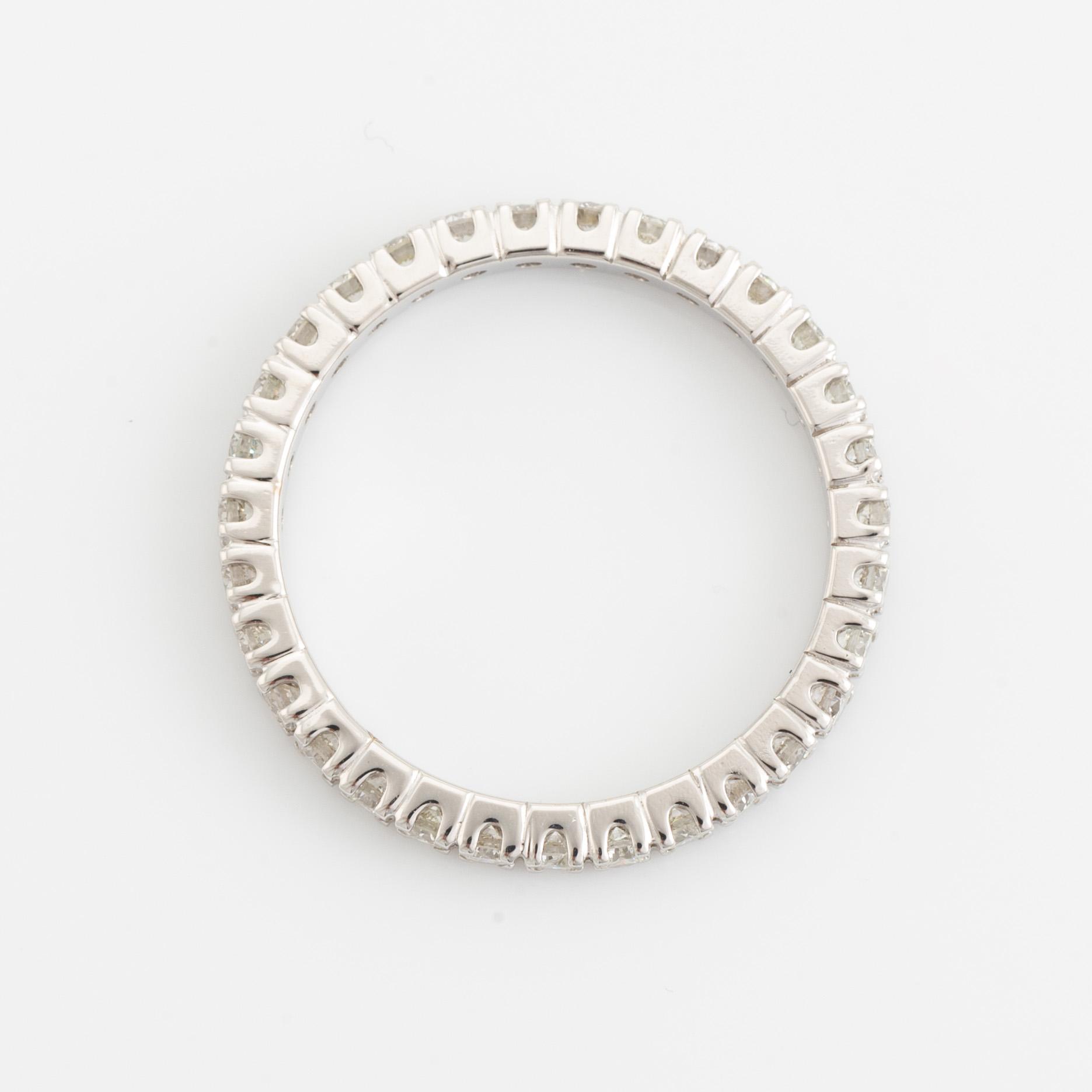Brilliant cut diamond eternity ring.