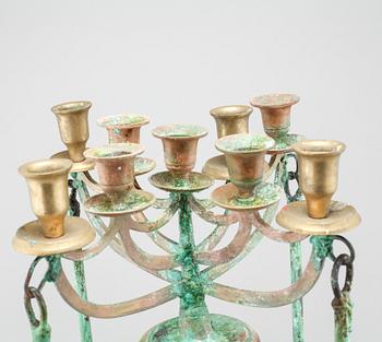 a metal sculpture/candelabra, signed and dated 2006.