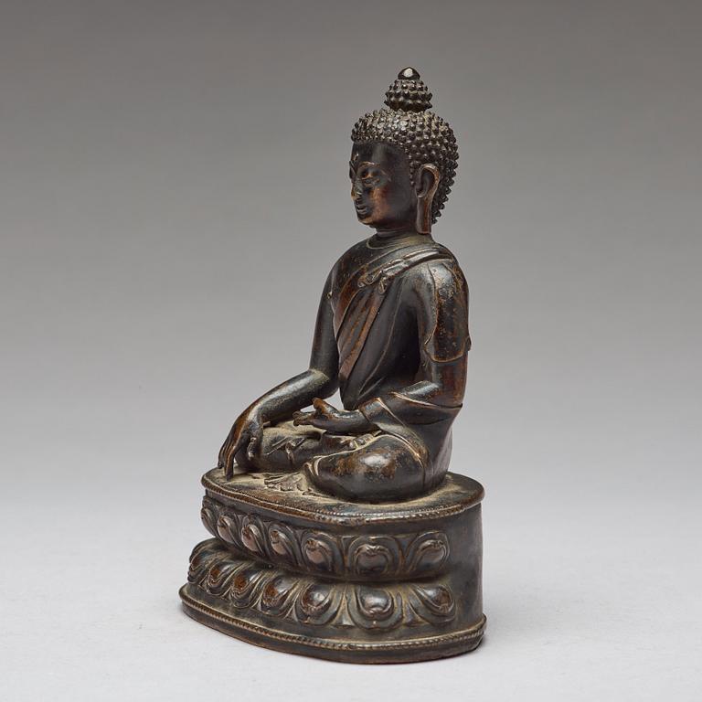 A copper alloy figure of Buddha Shakyamundi, Tibet, 17th Century.