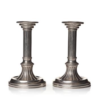 142. A pair of Gustavian pewter candlesticks by R Ryman 1784.