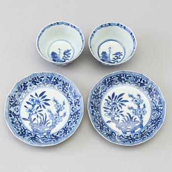 A pair of blue and white porcelain cups with saucers, Qing dynasty, 19th century, in Kangxi style.