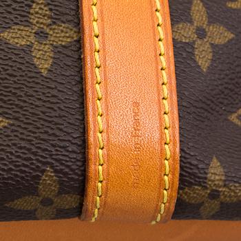 A "Petit Noé" monogram canvas handbag from Louis Vuitton.