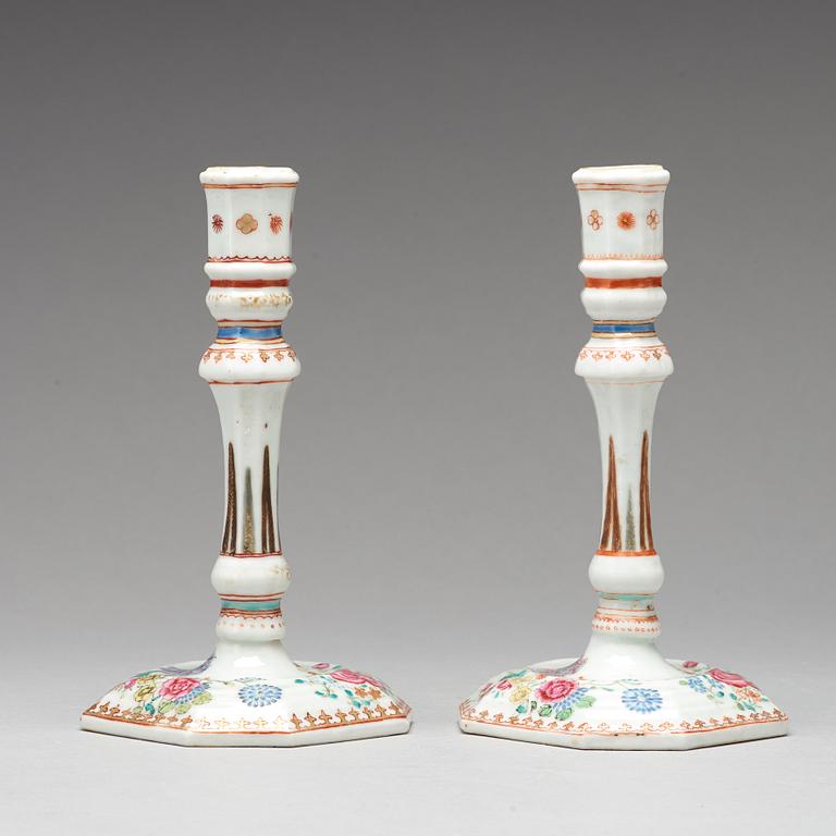 A pair of famille rose candle sticks, Qing dynasty, Qianlong (1736-95).