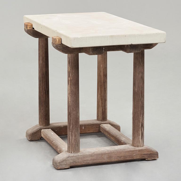 Axel Einar Hjorth, a "Sandhamn" stained pine table with a limestone top, Nordiska Kompaniet, Sweden 1929.