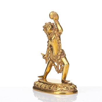 A gilt bronze figure of Dakini, Tibeto-Chinese, 19th Century.