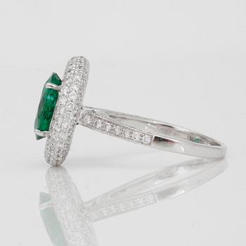 A 3.16ct Zambian emerald (minor oil) and brilliant-cut diamond ring. Certificate from C. Dunaigre.