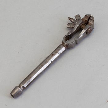 AN 18TH CENTURY STEEL SILVERSMITH'S TOOL.