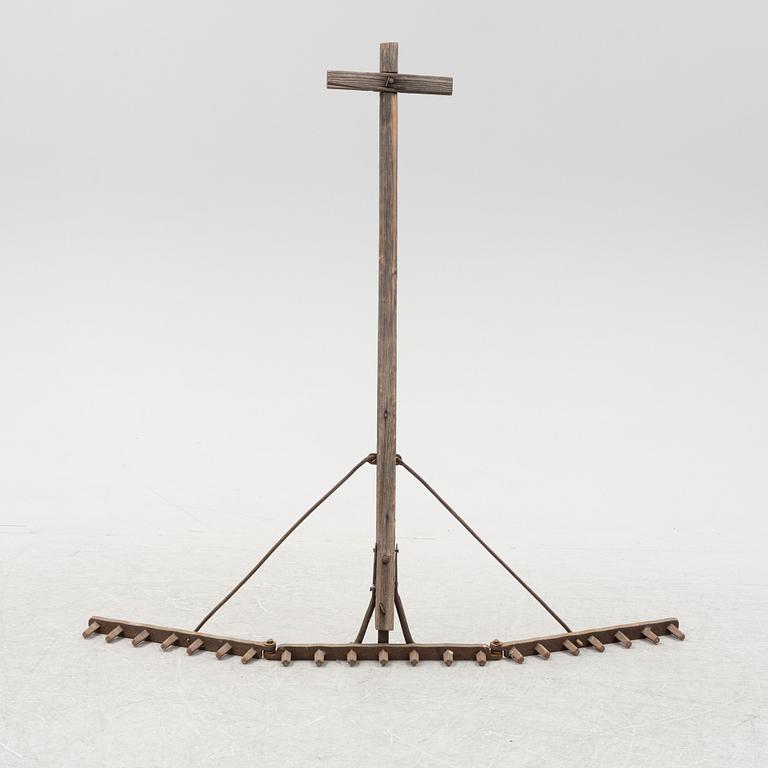 A wood and iron harrow, around the year 1900.