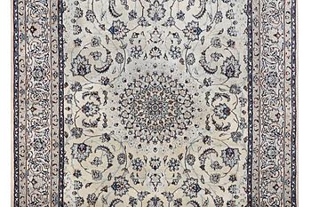 A Nain carpet, part silk, 6 laa, c. 294 x 193 cm.