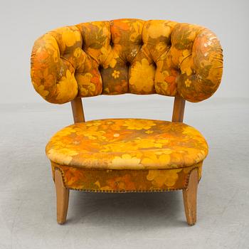 A mid 20th century "Schulz" easy chair by Otto Schulz.