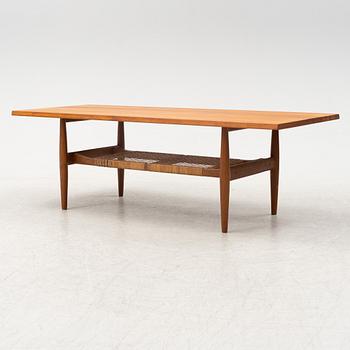 A composite teak coffee table with a rattan shelf, Denmark, 1950/60s.