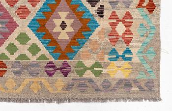 A Kelim rug, c. 252 x 180 cm.