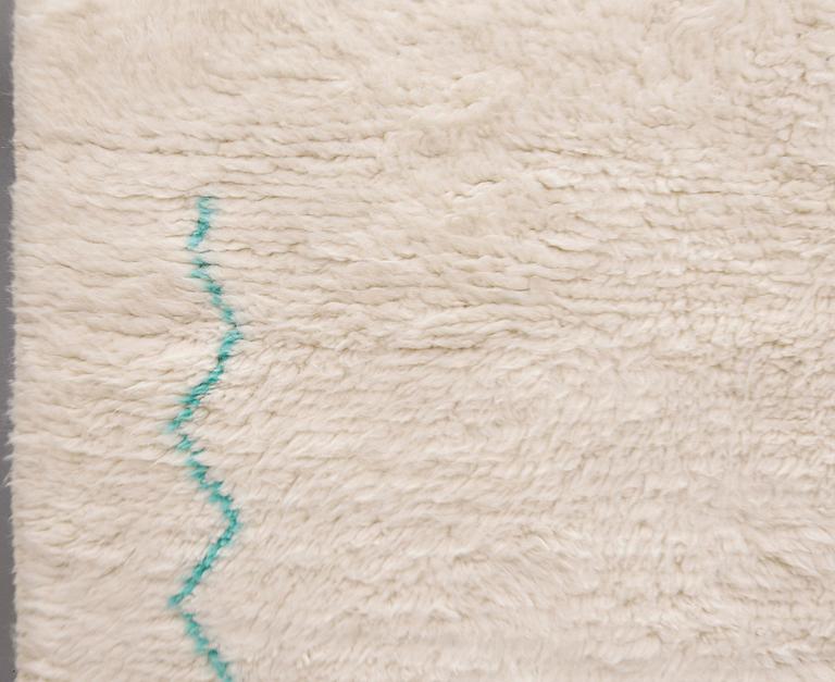 A Moroccan rug, approx. 257 x 166 cm.