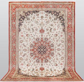 A silk Ghom carpet, 295 x 195 cm.