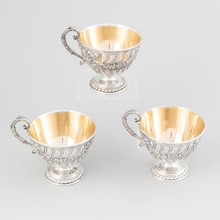 Three parcel-gilt silver chocolat-cups, mark of CG Hallberg, Stockholm 1896. Louis XVI-style.