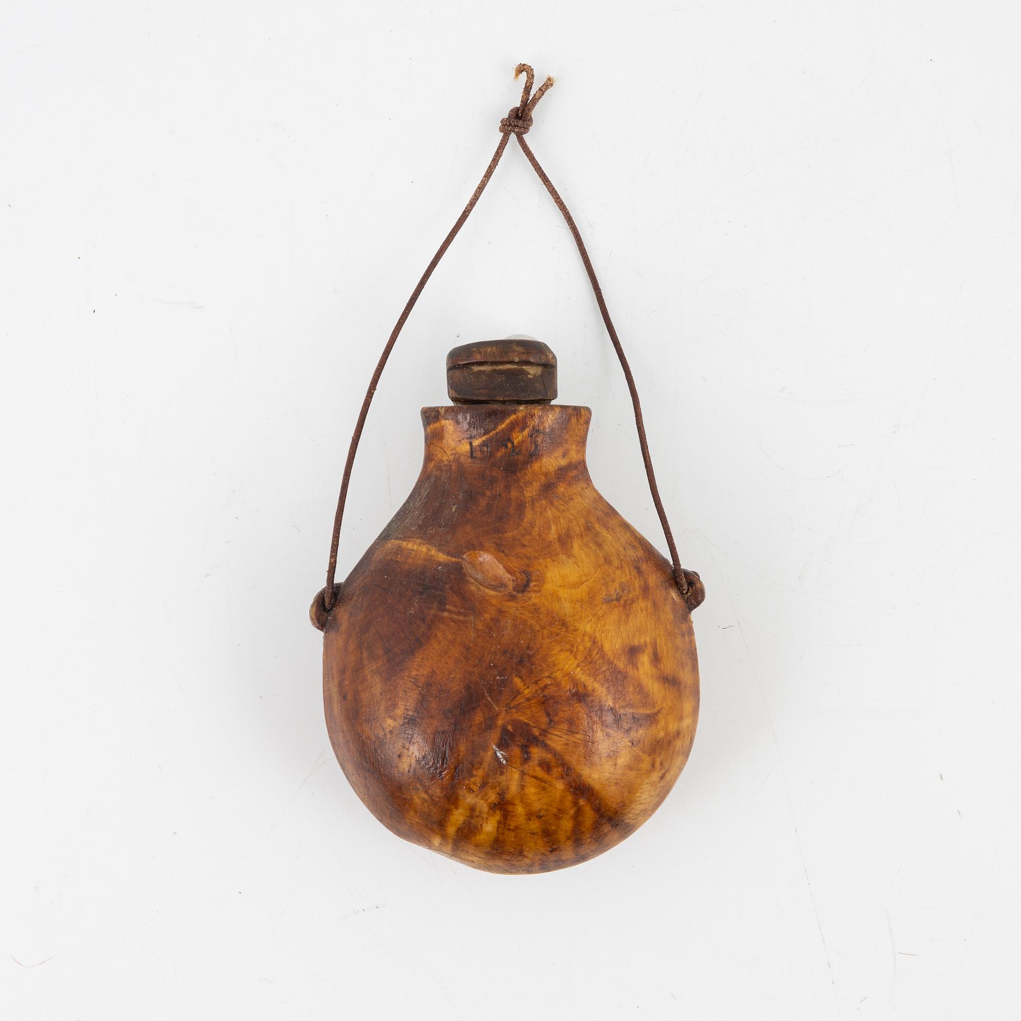 A birch salt bottle, dated 1925.