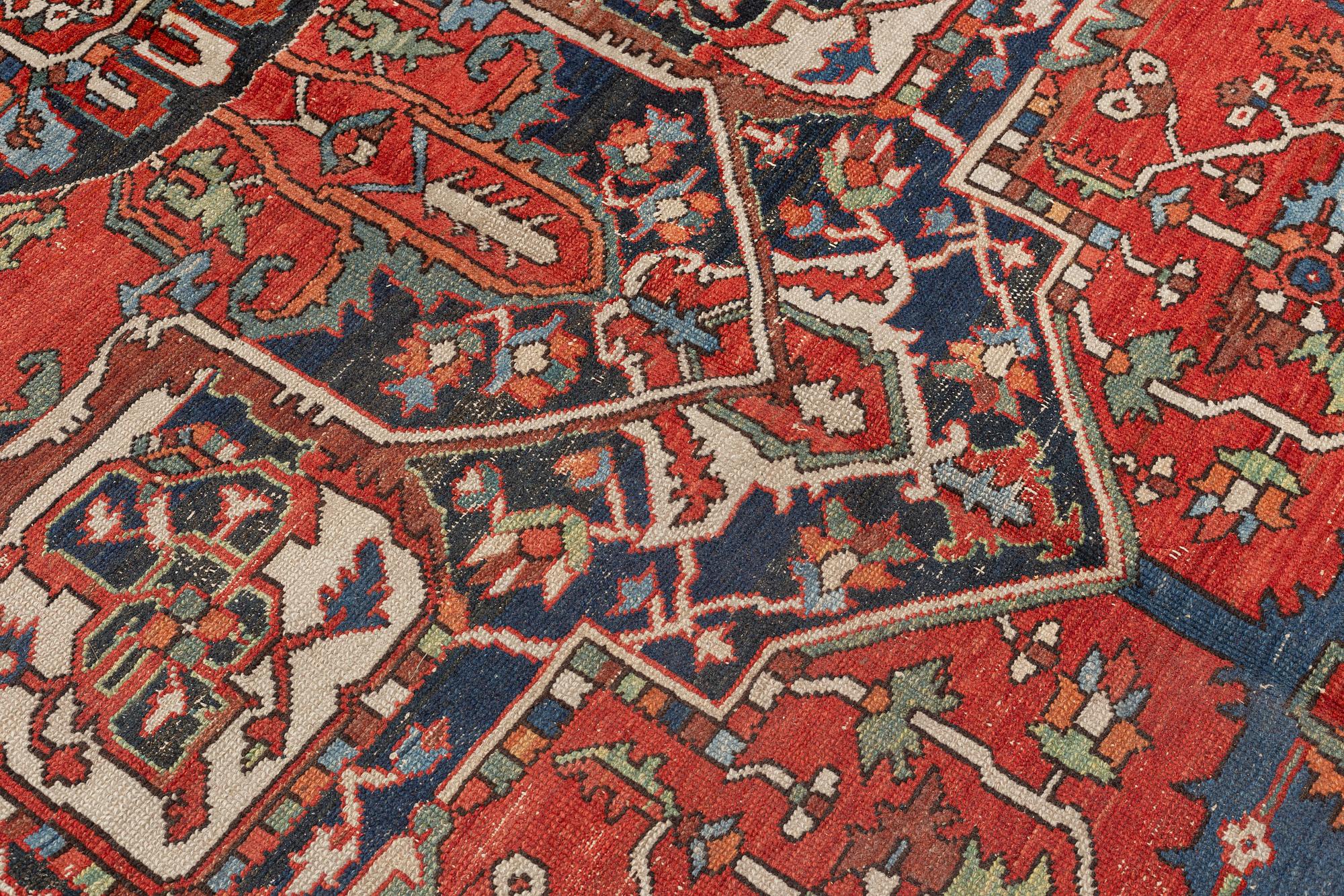 An antique Heris/Karadja carpet, approximately 501 x 339-353 cm.
