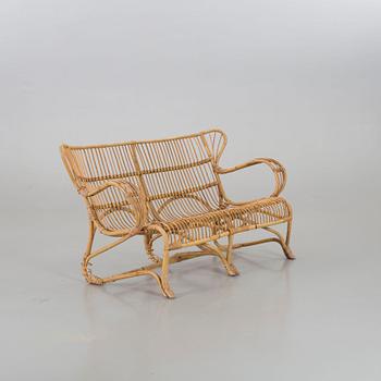 A mid 20th century ratten couch.