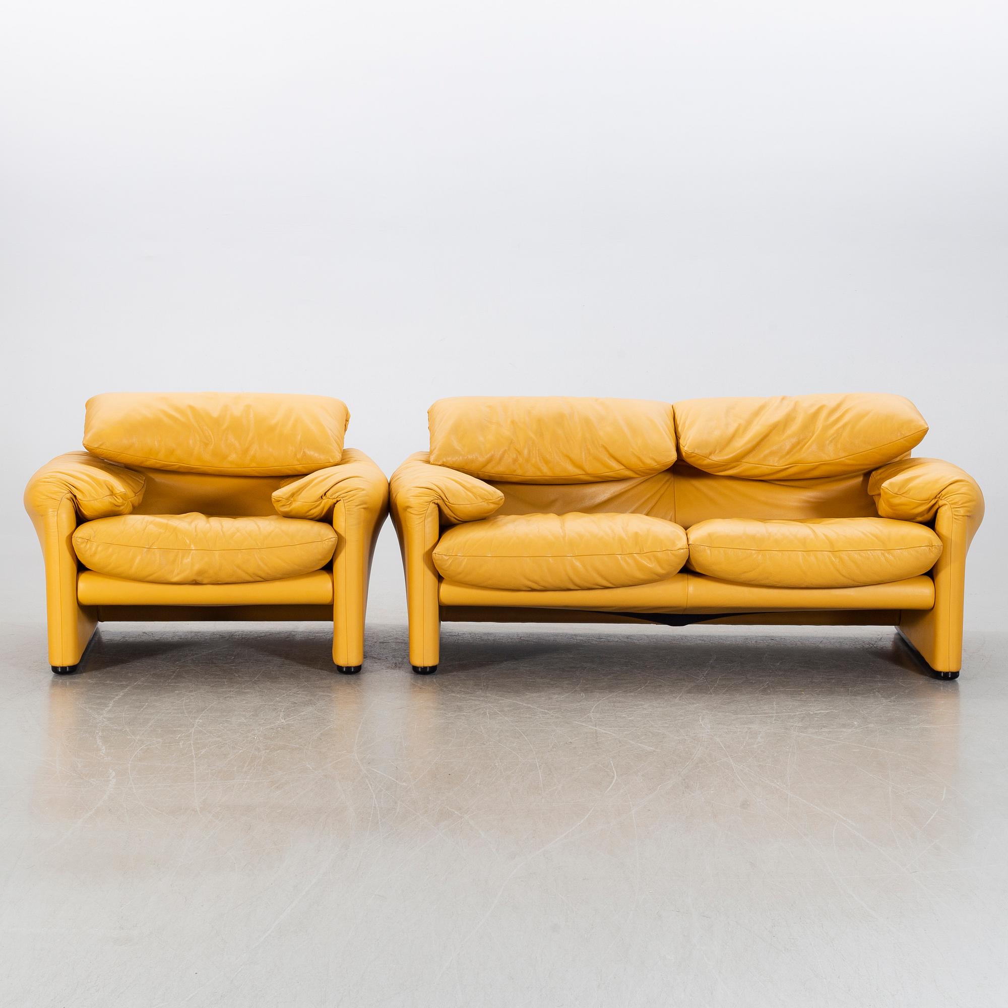 A "Maralunga" leather sofa and easy chair by Vico Magistretti, Italy.