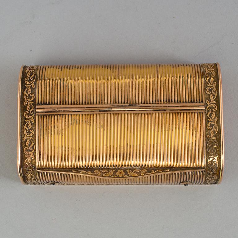 A brass music box, about 1900.