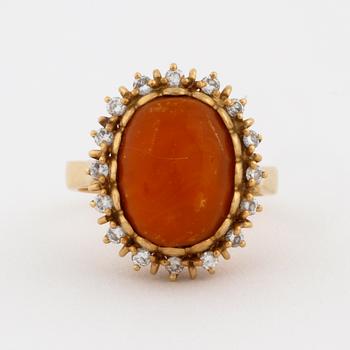 A amber and brilliant cut diamond ring by Walters guldsmedja, Stockholm, 1991.