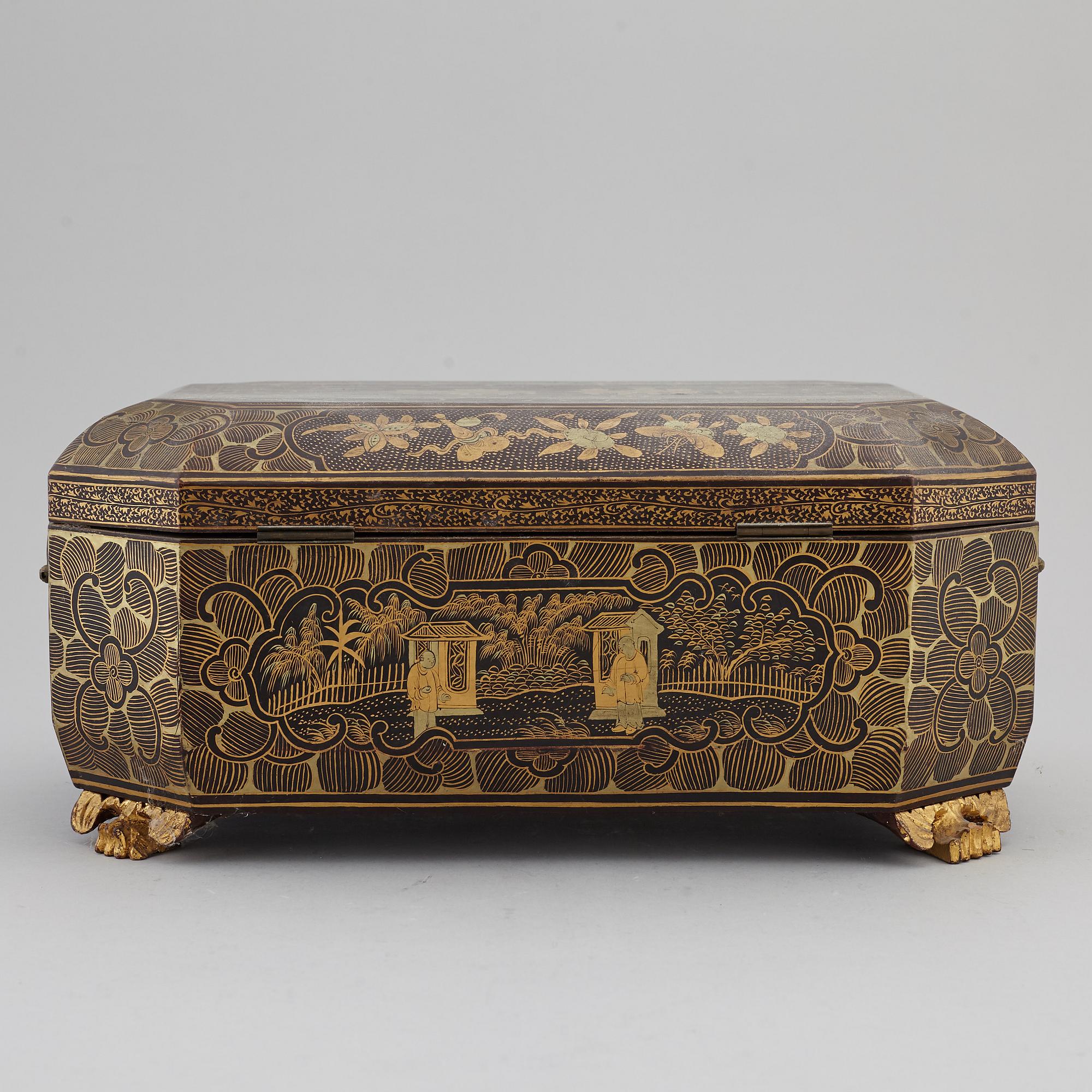 A lacquered sewing cabinet, Qing dynasty, 19th century.