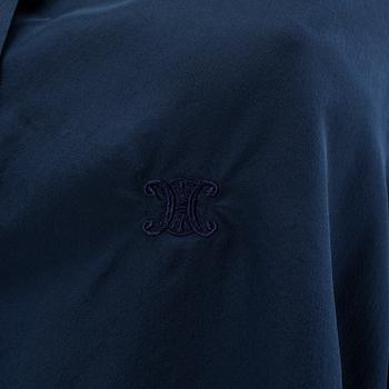 A navyblue silk blouse by Cèline.