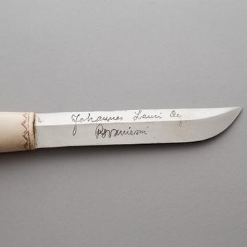 A SAMI KNIFE by Johannes Lauri, Rovaniemi, bone and leather, 20th century.