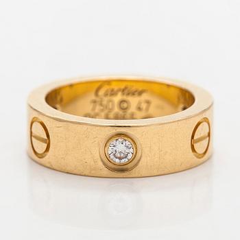 Cartier, an 18K gold 'Love' ring with three brilliant-cut diamonds.