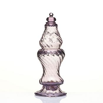 An amethyst coloured suger shaker and a cut glass goblet, 18th century.