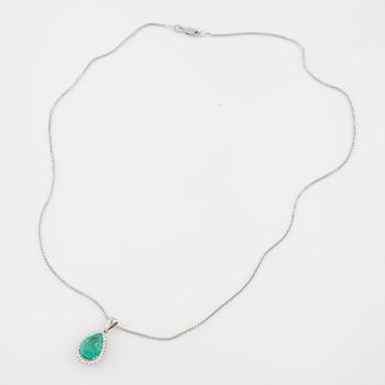 An emerald and brilliant cut diamond pendant.