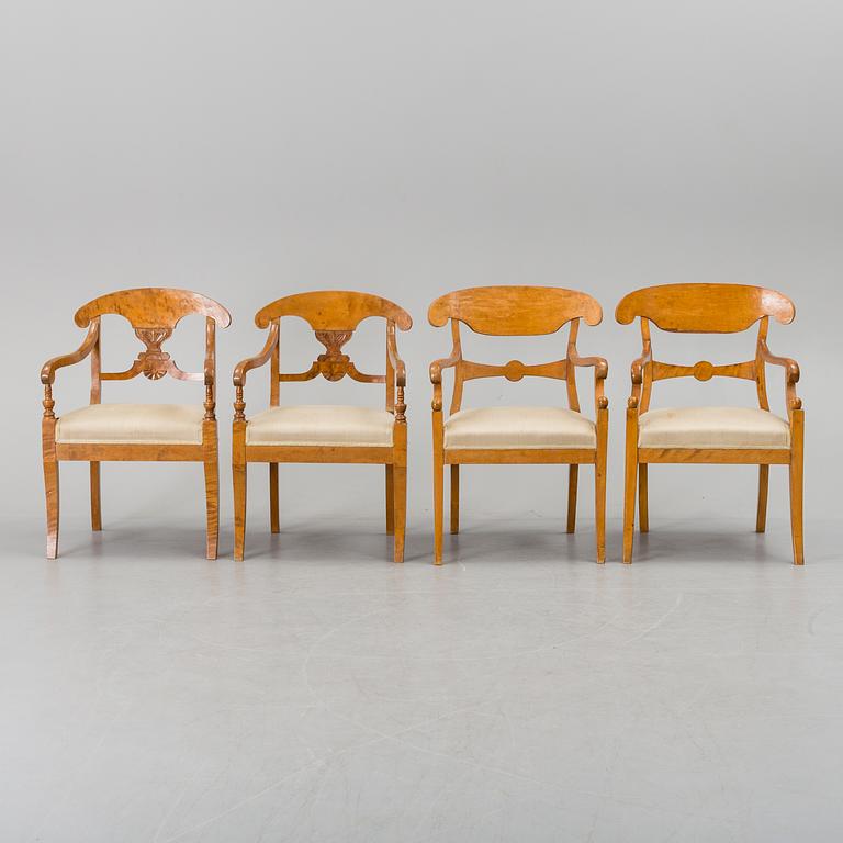 A set of four mid 19th century arm chairs.