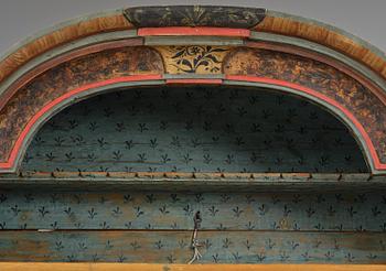 A polychrome-painted folk art cabinet from Värmland, Sweden, dated 1818.