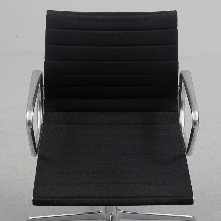 A 'EA 104 Swivel' armchair by Charles & Ray Eames, Vitra, 2016.