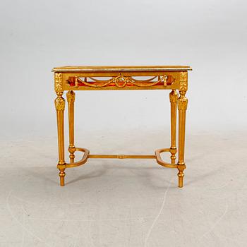 A gilded Louis XVI style display table first half of the 20th century.