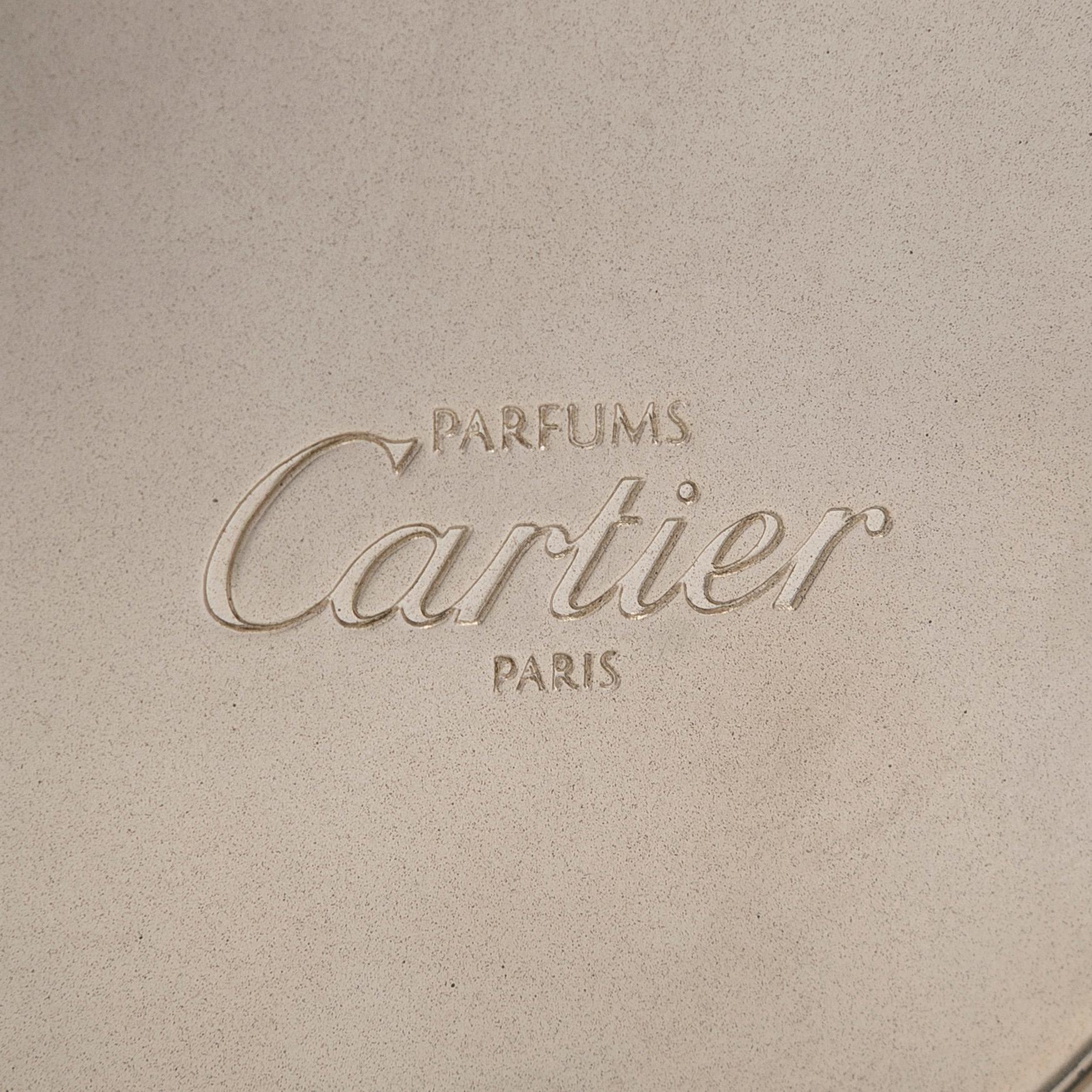 Cartier, parfymfodral med parfymflaska och sminkspegel.