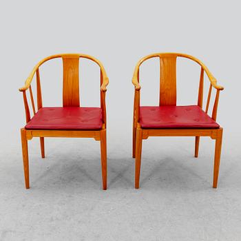 Hans J Wegner, a pair of "China" chairs for Fritz Hansen, Denmark, dated 1994.