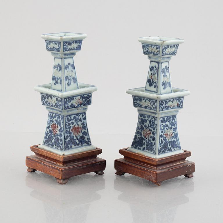A pair of Chinese porcelain altar sticks, late Qing dynasty.