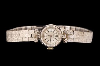 ARMBANDSUR, 18k vitguld med 6 briljantslipade diamanter ca 0,12ct. Certina 1970-tal. Vikt ca 28g.