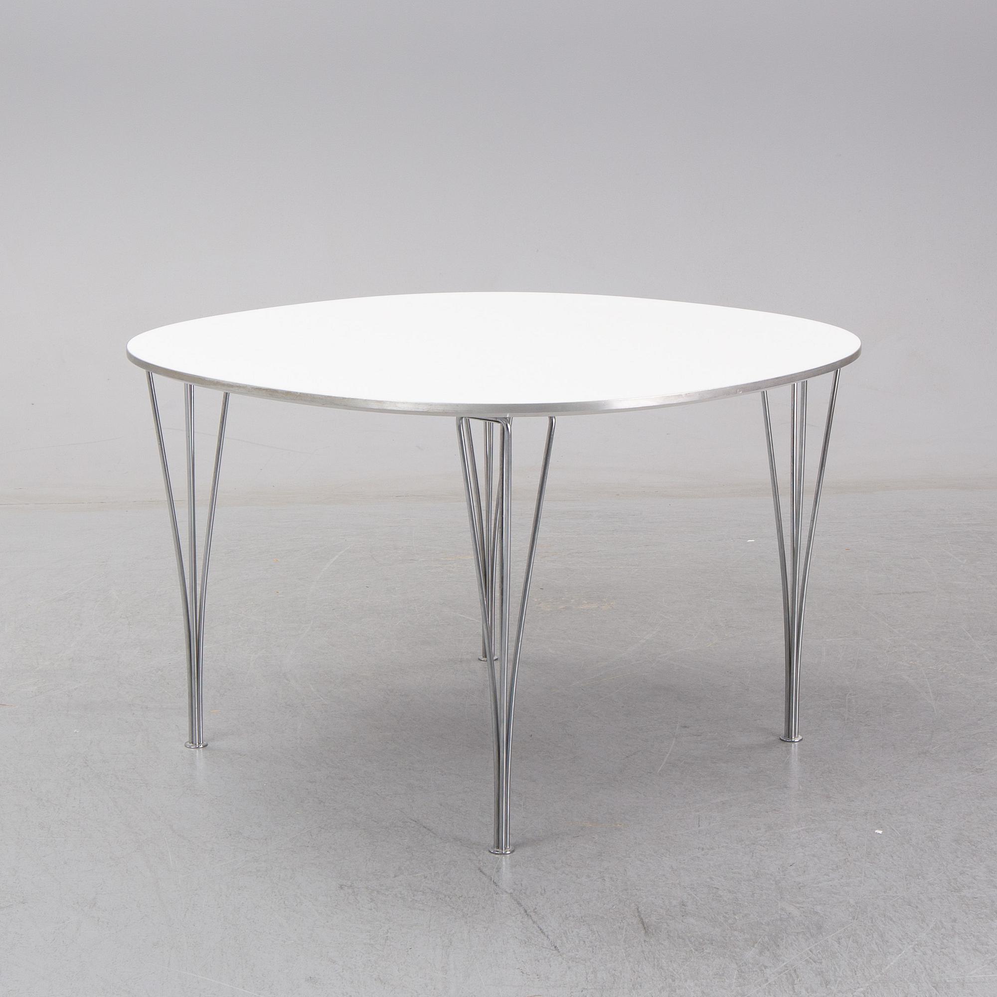 A 'Supercircle table by Bbruno Marthsson & Piet Hein for Fritz Hansen, dated 2000.
