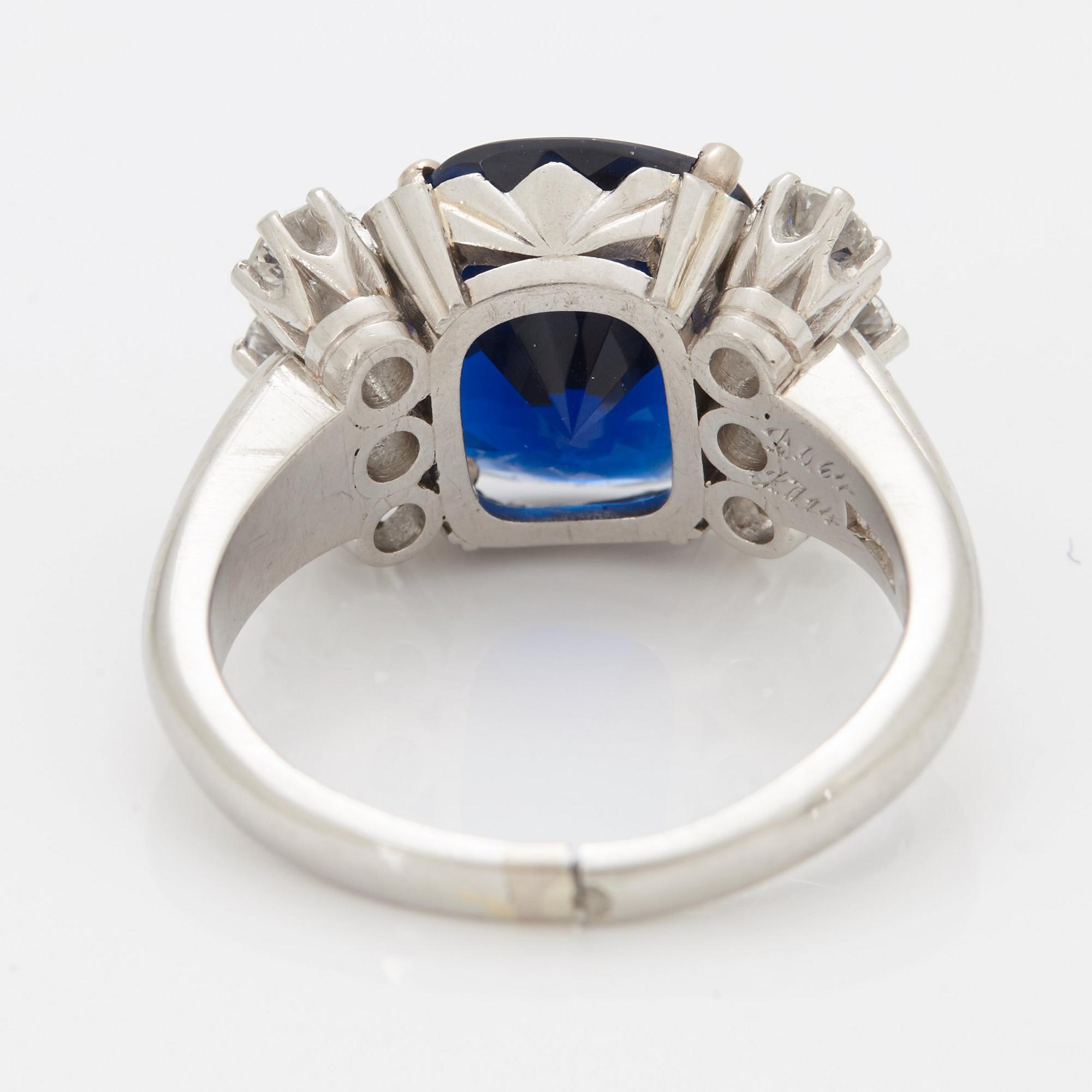 A RING set with a faceted sapphire.